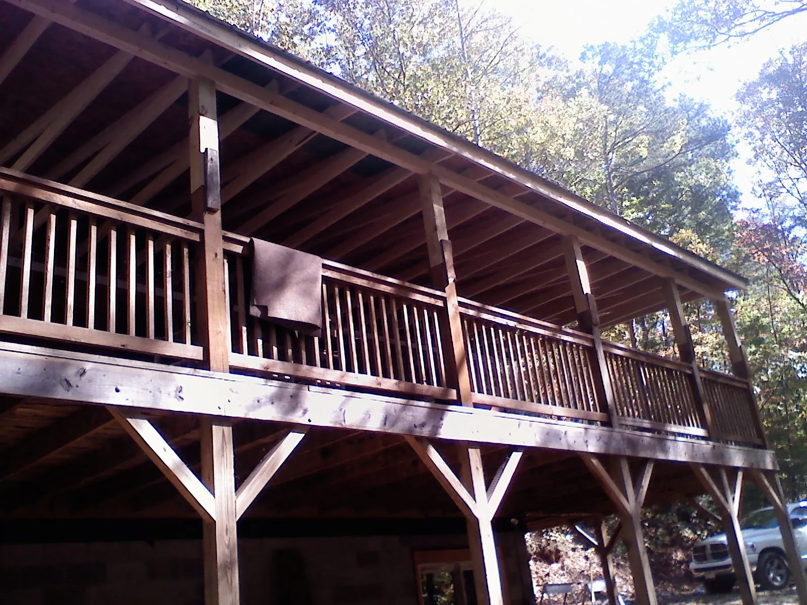 Timber framing under a new elevated porch and deck — Roof Leak Repair in Dodge City by Roofing Brothers